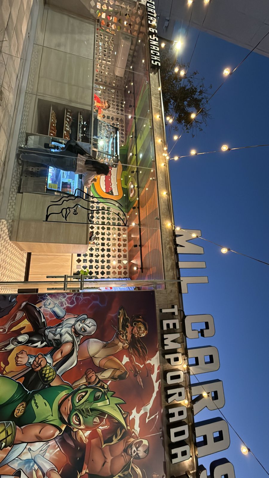Masked street performer at dusk